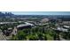 Denver condos near highways and Denver skyline, surrounded by lush green trees and city life at 2240 N Clay St # 406, Denver, CO 80211