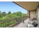 Spacious balcony with comfortable seating and views of mature trees and a charming neighborhood at 2240 N Clay St # 406, Denver, CO 80211