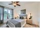 Comfortable bedroom featuring a ceiling fan, large window and soft, natural lighting at 2240 N Clay St # 406, Denver, CO 80211