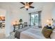 Serene bedroom with a ceiling fan, neutral tones, large window, and tasteful decor at 2240 N Clay St # 406, Denver, CO 80211