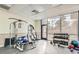 Fully-equipped gym featuring weight machines, free weights, and large windows for natural light at 2240 N Clay St # 406, Denver, CO 80211