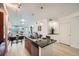 Bright kitchen with stainless steel appliances, an island, and an open floor plan to living area at 2240 N Clay St # 406, Denver, CO 80211