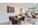 Bright living room featuring a modern decor, comfortable seating, and a dining area at 2240 N Clay St # 406, Denver, CO 80211