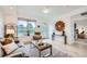 Spacious living room with modern decor, large windows, and seamless access to the balcony at 2240 N Clay St # 406, Denver, CO 80211