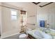 Bathroom featuring a shower and bathtub with natural light from the window at 3777 S Walden St, Aurora, CO 80013