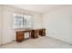 Bedroom featuring a large window and a spacious desk area at 3777 S Walden St, Aurora, CO 80013