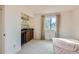 Bedroom featuring a wet bar area and natural light at 3777 S Walden St, Aurora, CO 80013