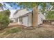 Two-story home exterior featuring neutral siding, brick chimney, and grassy yard at 3777 S Walden St, Aurora, CO 80013