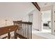 Upstairs hallway featuring wood trim and doors leading to the various rooms at 3777 S Walden St, Aurora, CO 80013