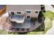Aerial view of backyard featuring an upper deck, patio, and mature landscaping at 6079 W Prentice Ave, Littleton, CO 80123