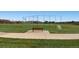 Community ball field with fenced enclosure, a bench, and soccer goal, perfect for outdoor games at 6079 W Prentice Ave, Littleton, CO 80123