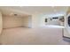 Finished basement with carpet, bright lighting, storage, and adjacent finished room with fireplace at 6079 W Prentice Ave, Littleton, CO 80123