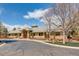Beautiful clubhouse exterior with well-maintained landscaping, stone accents, and convenient parking at 6079 W Prentice Ave, Littleton, CO 80123