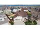 Lovely home featuring a three-car garage, manicured lawn, a fenced yard, and proximity to a serene blue lake at 6079 W Prentice Ave, Littleton, CO 80123