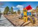 Fun community playground with colorful play structures, a slide, and shaded seating areas for families at 6079 W Prentice Ave, Littleton, CO 80123