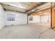 Bright, unfinished basement with insulated walls, exposed ceiling, and concrete flooring at 821 Boulder Peak Ave, Erie, CO 80516