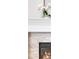 Bright fireplace with stone accents and white trim for a cozy and modern aesthetic at 821 Boulder Peak Ave, Erie, CO 80516