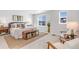 Bright, spacious main bedroom featuring a king bed, neutral decor, and lots of natural light at 821 Boulder Peak Ave, Erie, CO 80516