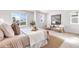 Serene main bedroom with neutral tones, natural light, and stylish furnishings at 821 Boulder Peak Ave, Erie, CO 80516