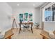 Stylish office space with a large window, desk, modern decor, and comfortable seating at 821 Boulder Peak Ave, Erie, CO 80516
