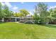 Green backyard with patio and grill at 2520 Eldridge Cir, Golden, CO 80401