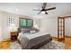 Calm bedroom with hardwood floors, soft gray bed, and side tables for a restful retreat at 2520 Eldridge Cir, Golden, CO 80401