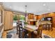 Bright dining area with hardwood floors, stylish chandelier, and sliding door access to the deck at 2520 Eldridge Cir, Golden, CO 80401