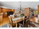Cozy dining area with hardwood floors, brick fireplace, and access to the living room at 2520 Eldridge Cir, Golden, CO 80401