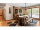 Inviting dining area with hardwood floors, rustic furniture, and natural light at 2520 Eldridge Cir, Golden, CO 80401