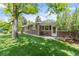 Charming single-story brick house with a well-maintained lawn and mature trees at 2520 Eldridge Cir, Golden, CO 80401