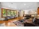 Bright living room with hardwood floors, large windows, and comfortable seating, perfect for entertaining guests or relaxing at home at 2520 Eldridge Cir, Golden, CO 80401