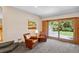 Cozy living room features sliding glass doors leading to the backyard at 2520 Eldridge Cir, Golden, CO 80401