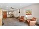 Bright living room with a ceiling fan, hardwood shutters, and comfortable seating at 2520 Eldridge Cir, Golden, CO 80401