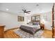 Serene main bedroom with hardwood floors and windows with wood shutters at 2520 Eldridge Cir, Golden, CO 80401
