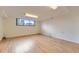 Spacious finished basement featuring wood-look flooring and a window at 916 W Alder St, Louisville, CO 80027