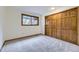 Cozy bedroom with a large closet and a window offering natural light at 916 W Alder St, Louisville, CO 80027