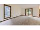 Bedroom featuring a large window with views to the deck, and a carpeted floor at 916 W Alder St, Louisville, CO 80027