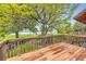 Spacious wooden deck with views of the lawn, trees, and lake at 916 W Alder St, Louisville, CO 80027