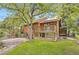 Exterior showcasing multi-level decks and lush landscaping at 916 W Alder St, Louisville, CO 80027