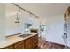 Bright kitchen featuring wooden cabinets, stainless steel appliances, and a center island with a cooktop at 916 W Alder St, Louisville, CO 80027