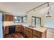 Bright kitchen featuring a cooktop island, wood cabinets, and scenic views at 916 W Alder St, Louisville, CO 80027