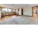 Open living area with built-in cabinets, leading to carpeted area at 916 W Alder St, Louisville, CO 80027