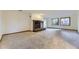 Spacious living room with a fireplace and large windows offering natural light at 916 W Alder St, Louisville, CO 80027