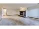 Open living room featuring a brick fireplace and neutral carpet at 916 W Alder St, Louisville, CO 80027