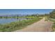 Scenic walking path along a tranquil lake with beautiful mountain views at 916 W Alder St, Louisville, CO 80027