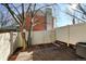 Cozy fenced back yard with a wooden deck and mature tree at 2030 Gyros Cir # 155, Lafayette, CO 80026