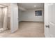 Finished basement with neutral carpet, a window, and an adjacent bathroom with walk-in shower at 2030 Gyros Cir # 155, Lafayette, CO 80026