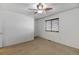 Cozy bedroom with neutral carpet, bright window, and fan at 2030 Gyros Cir # 155, Lafayette, CO 80026