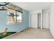 Bedroom with carpet, large window overlooking a field, closet with folding doors, and light blue walls at 2030 Gyros Cir # 155, Lafayette, CO 80026