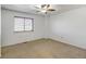 Bedroom featuring carpet floors, a ceiling fan, and a large window with blinds for natural light at 2030 Gyros Cir # 155, Lafayette, CO 80026
